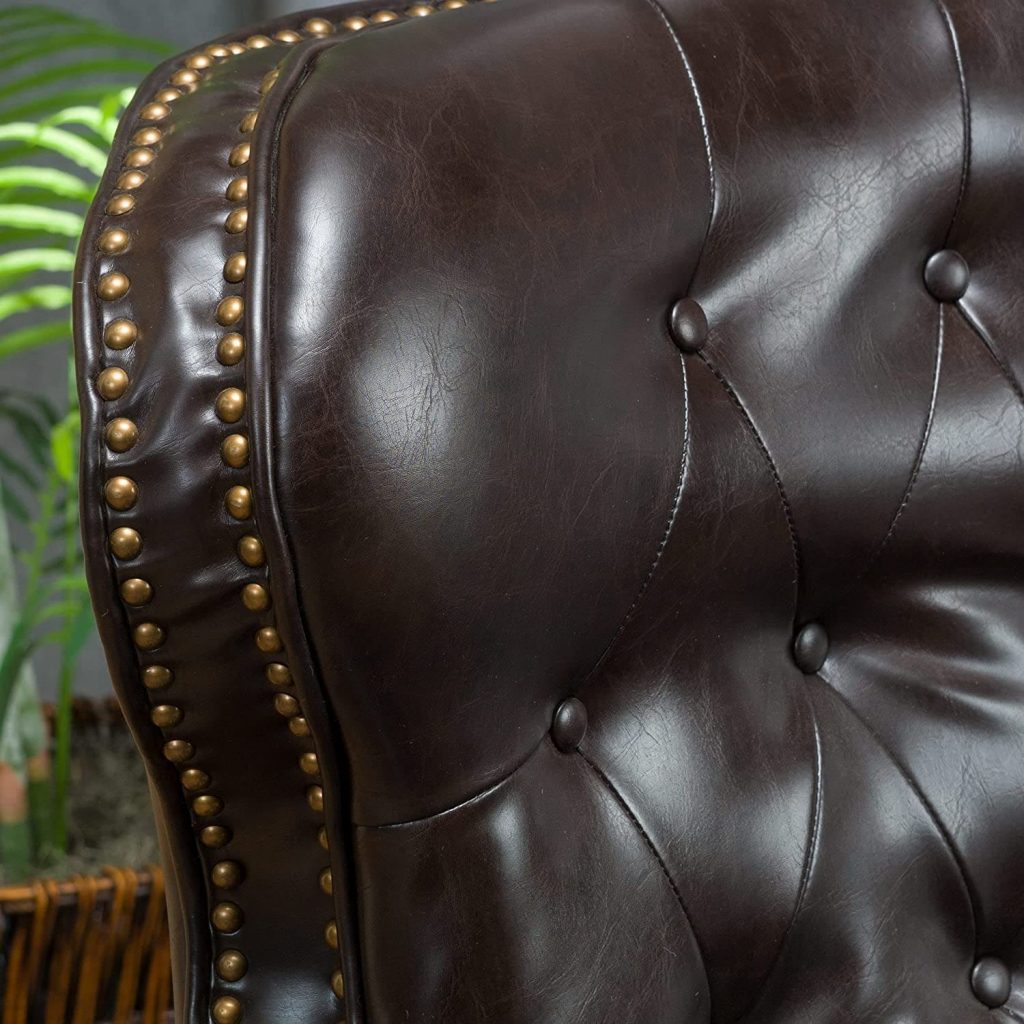 leather club chair recliners - close up view of nail head trim and tufted back