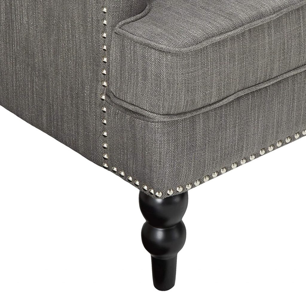 neutral accent chair - close up view of studded trim